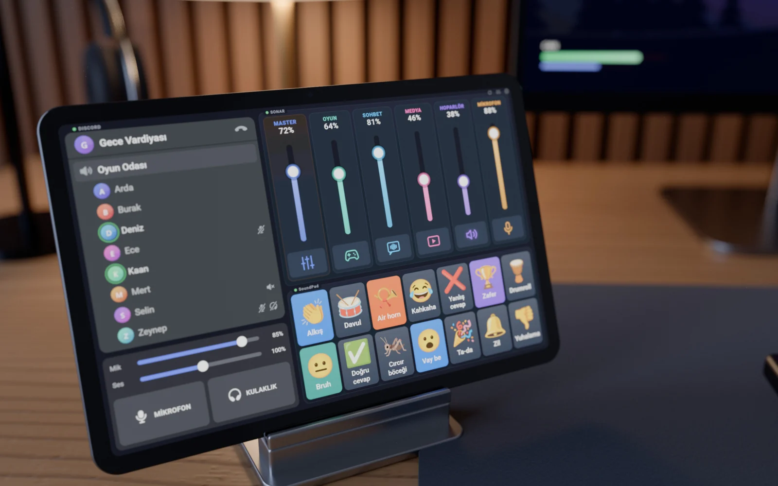 Close-up of the tablet on its stand: Discord room, mixer sliders and SoundPad buttons